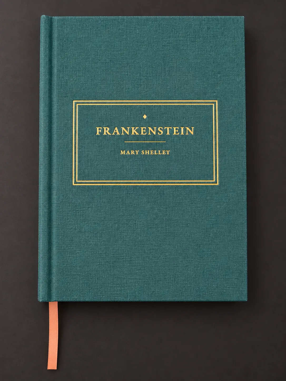 Teal clothbound Frankenstein by Mary Shelley with a gold-stamped cover and orange ribbon bookmark